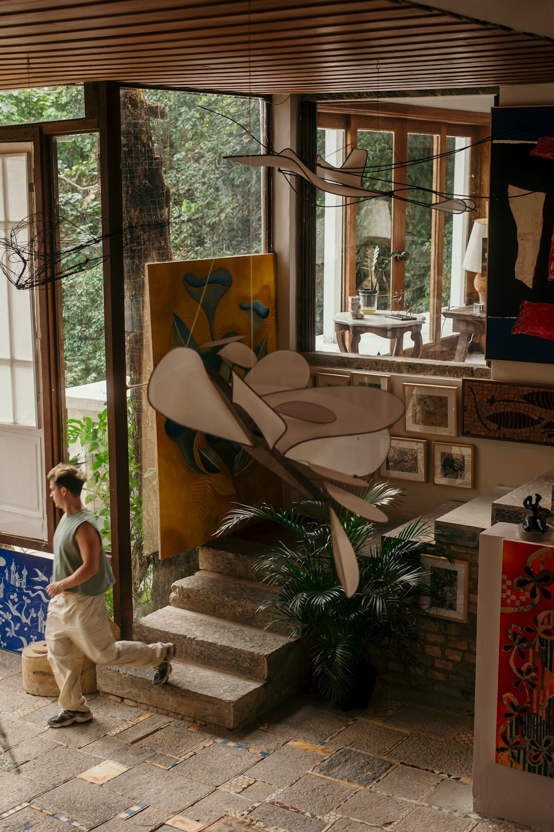 Brazilian woman writing in a journal by a window