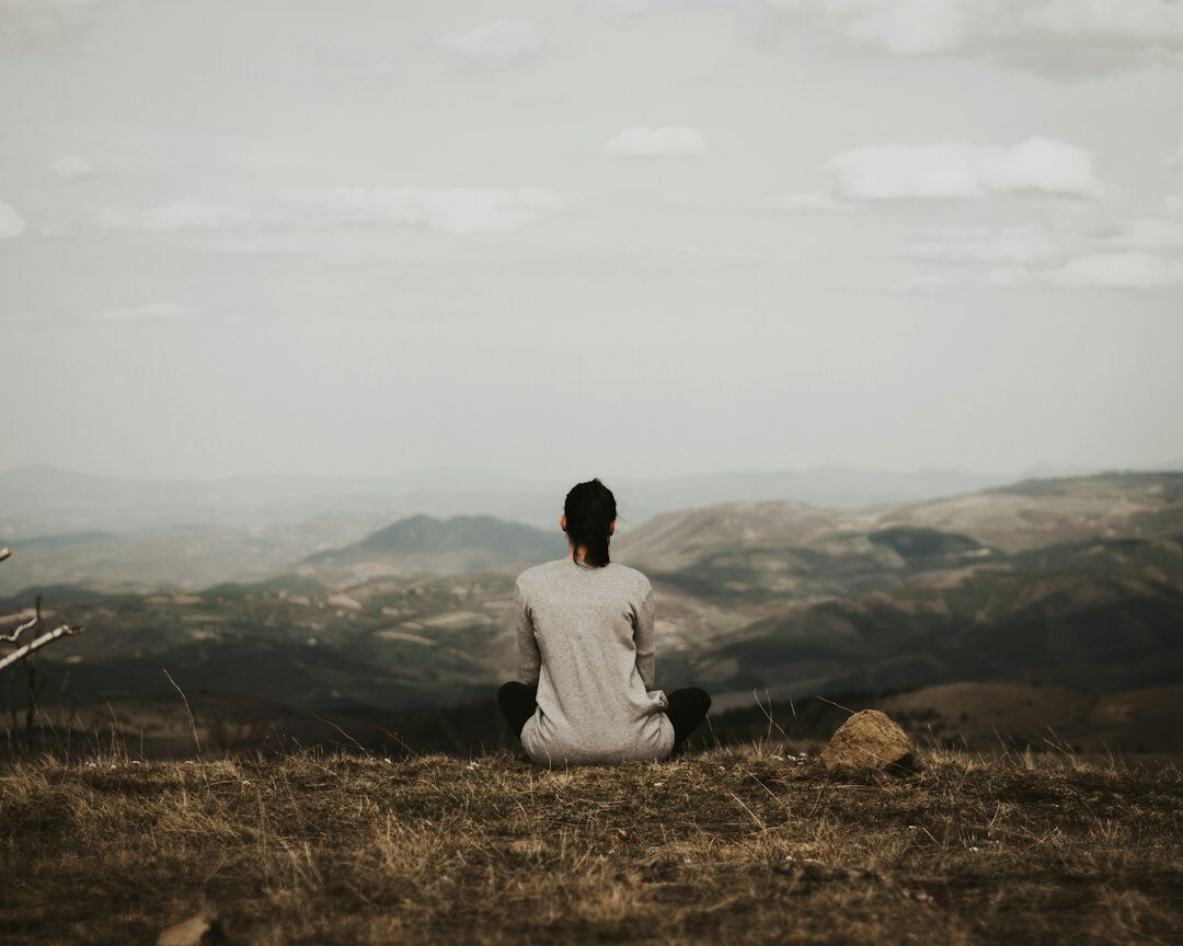 Brazilian man meditating calmly at home in the morning