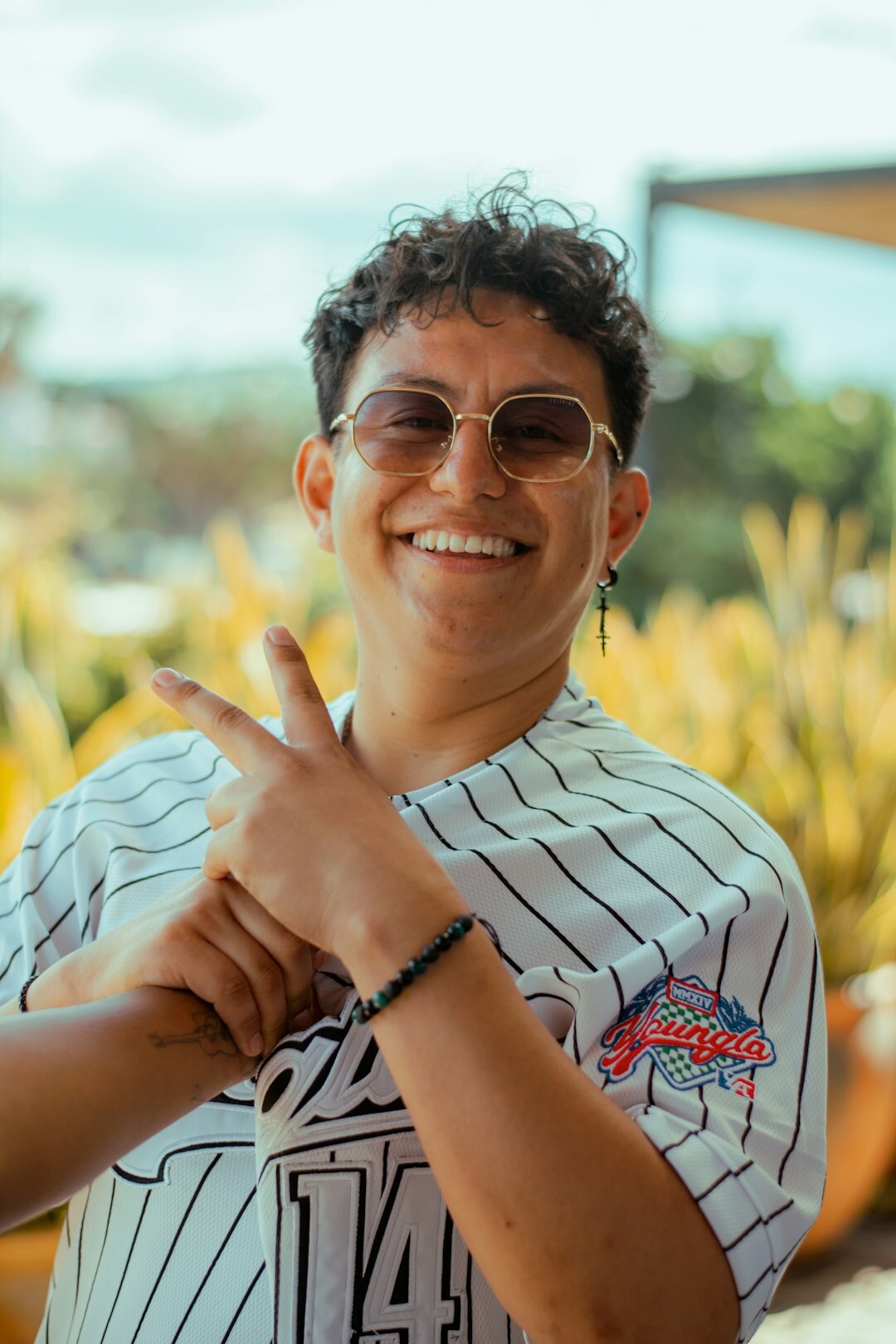 Brazilian man with glasses smiling professionally